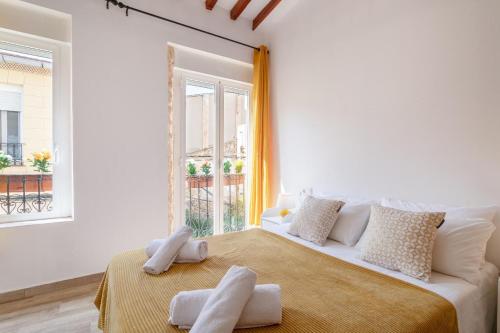Postel nebo postele na pokoji v ubytování Bel appartement rustique au cœur d'Alicante