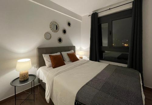a bedroom with a large bed and a window at YOUR CHOICE in Bar