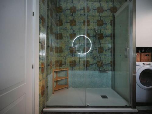 a shower with a glass door in a bathroom at A+View Private Terrace Private Pool Family Fun in Badalona