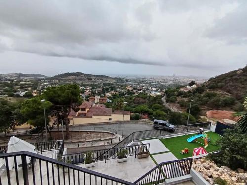 a view of a park with a playground at A+View Private Terrace Private Pool Family Fun in Badalona