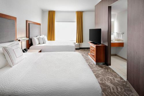 Postel nebo postele na pokoji v ubytování SpringHill Suites Scottsdale North