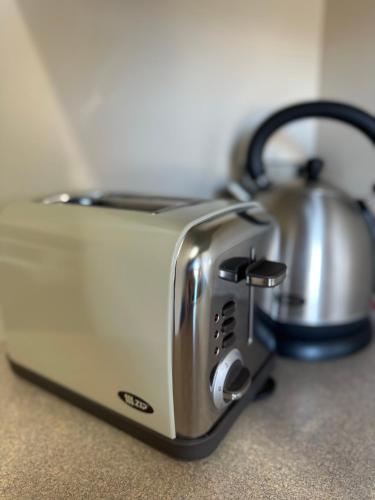 a toaster sitting on top of a counter at The Suites Ashburton in Ashburton