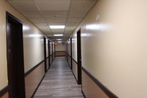a hallway of an office building with a long corridor at Bellevue Hotel and Suites in Bellevue