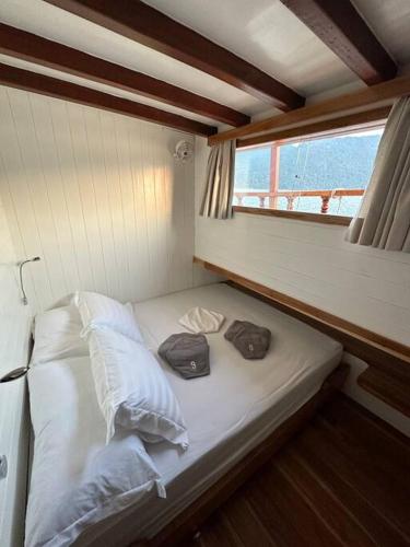 A bed or beds in a room at Escuna clássica 80 pés