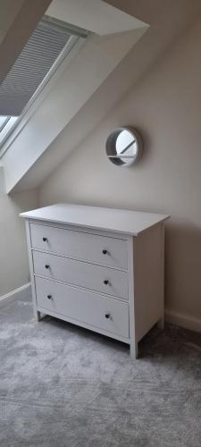 a white dresser in a room with a ceiling at 26 Lindhurst Way West in Mansfield