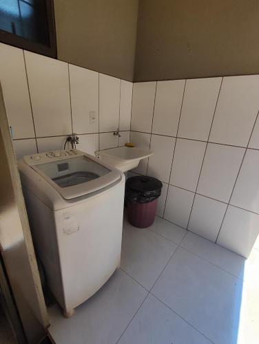 a small bathroom with a sink and a toilet at H-67 House in Campo Grande