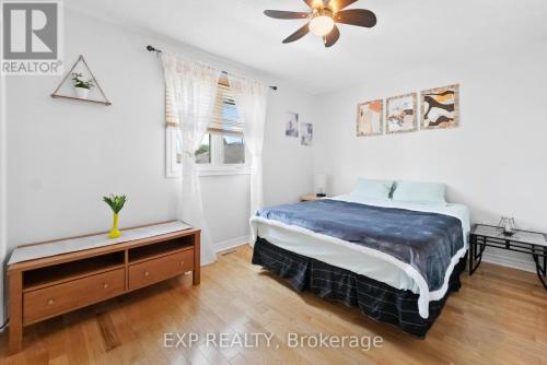 a bedroom with a bed and a ceiling fan at Cozy Place-Laid Back in Mississauga