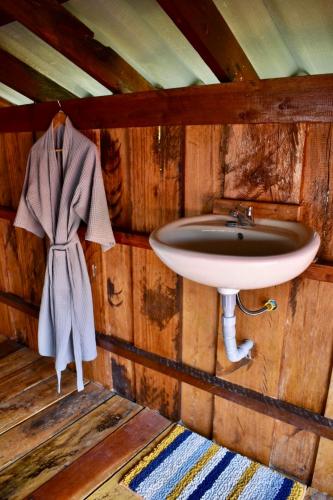 a bathroom with a sink in a wooden cabin at Beach House Cambodia in Koh Rong Sanloem