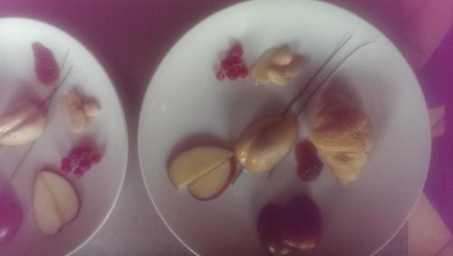 two white plates with different types of food on them at Country House Salomè in Musile di Piave