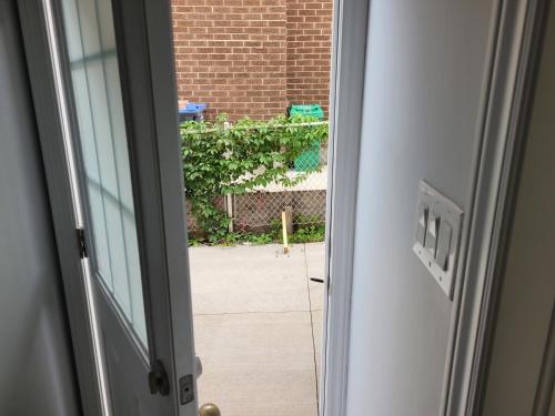 an open door with a view of a courtyard at Relax place in Brampton