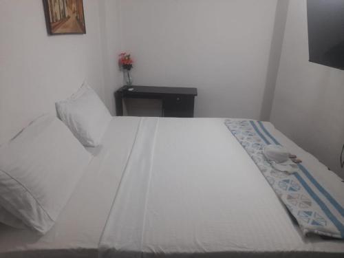 Postel nebo postele na pokoji v ubytování HOTEL HOUSE CIA