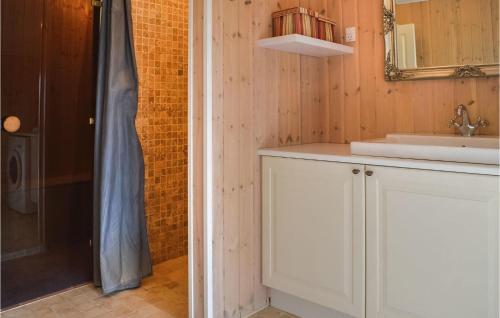 a bathroom with a sink and a shower at Frk, Lyng in Harboør