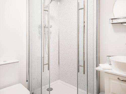 a shower with a glass door in a bathroom at Invergyle - Uk40566 in Falkland