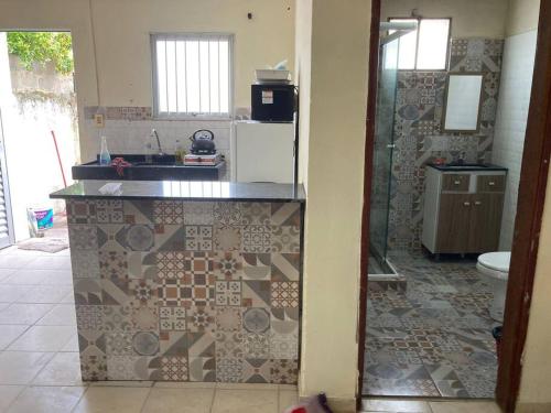 a kitchen with a sink and a counter top at Casa centrica! in Artigas