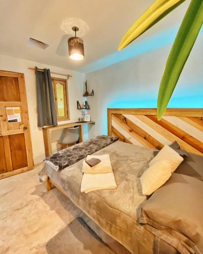 a bedroom with a large bed in a room at Hostel Boutique 55 in San Cristóbal de Las Casas