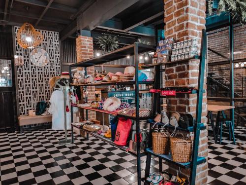 a store with a black and white checkered floor at Na Siam Guesthouse in Phuket Town
