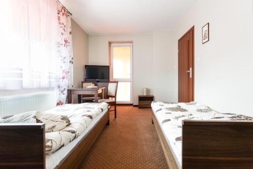 Una cama o camas en una habitación de Sleep In Łomża
