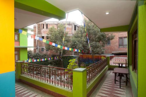 a balcony with a colorful string of flags on it at Hotel Green Horizon in Kathmandu