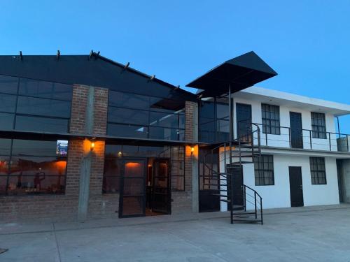 a building with a staircase on the side of it at Finca del Rincón in Guadalupe
