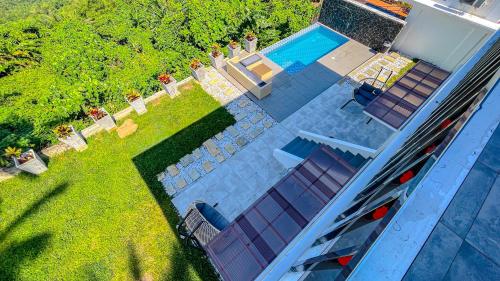 an overhead view of a house with a swimming pool at Caliraya Heights Resorts and Events Place in Halang