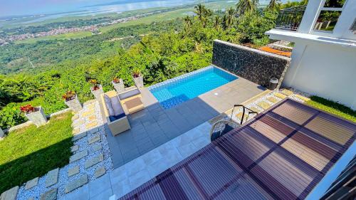 an aerial view of a house with a swimming pool at Caliraya Heights Resorts and Events Place in Halang