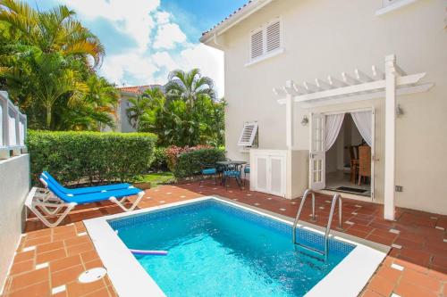 a swimming pool in the backyard of a house at Turtle View 2 by BSL Rentals in Saint James