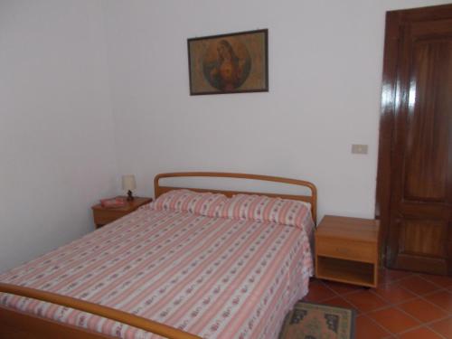 A bed or beds in a room at Casa Vacanze Liperni
