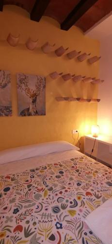 a bedroom with a bed with a patterned bedspread at Huerta Solana in Castril