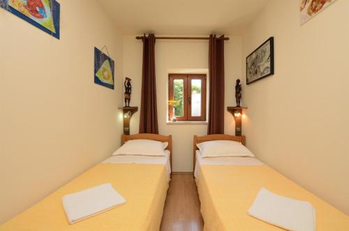 Postel nebo postele na pokoji v ubytování Apartments Haldej