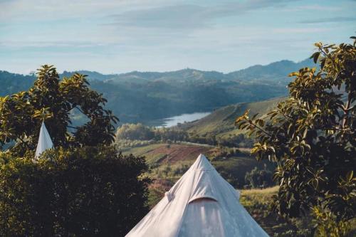 a tent sitting on top of a hill overlooking a valley at Papa Garden Khaokho in Khao Kho
