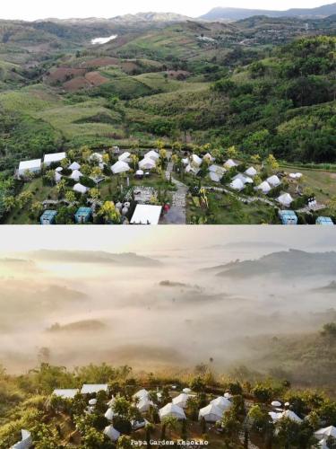 an aerial view of a village with tents in a field at Papa Garden Khaokho in Khao Kho