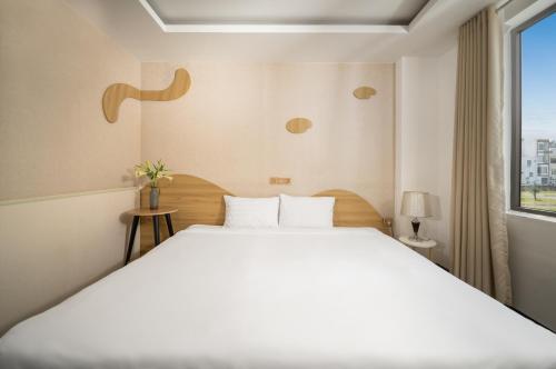 Ένα ή περισσότερα κρεβάτια σε δωμάτιο στο Hanami Suite and Apartment