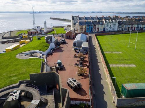 an aerial view of a town with the ocean at No. 20 The Headland in Hartlepool