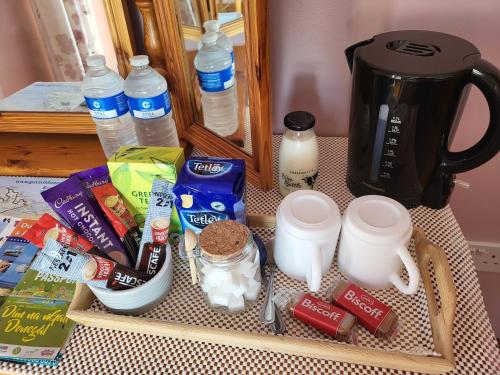 a counter with a tray of food and a coffee maker at Castleview in Milltown