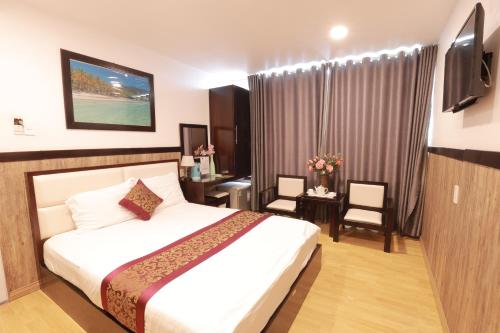 TV a/nebo společenská místnost v ubytování Hotel Minh Hang