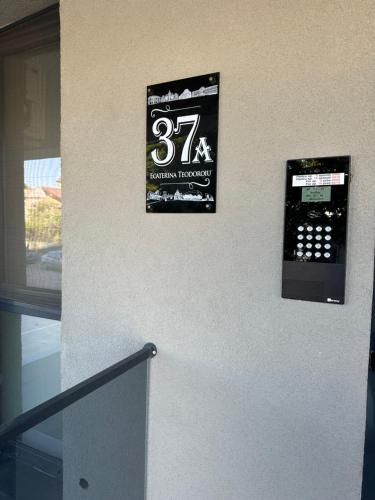 a sign on the side of a building that says thirty sevenventhiversary at Stadium Central Apartment Residence & terrace in Craiova