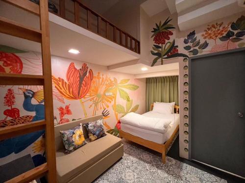 a bedroom with two bunk beds and a bed at Suraya Bangkok in Bangkok