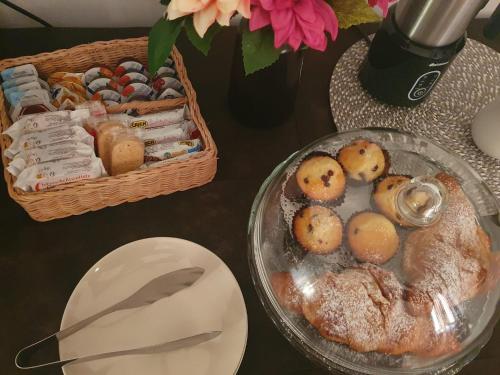 a table with a plate of food and a basket of food at La casa dei nonni in San Salvo