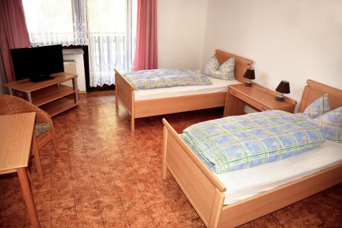 Katil atau katil-katil dalam bilik di Pension Bergbauer