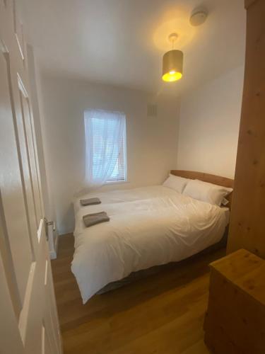 a bedroom with a white bed and a window at Two bedroom apartment in Ennis v95D854 in Ennis