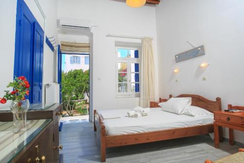 A bed or beds in a room at Paros Rita Studios