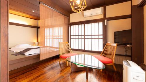 Postel nebo postele na pokoji v ubytování Ryokan Hiyoshi