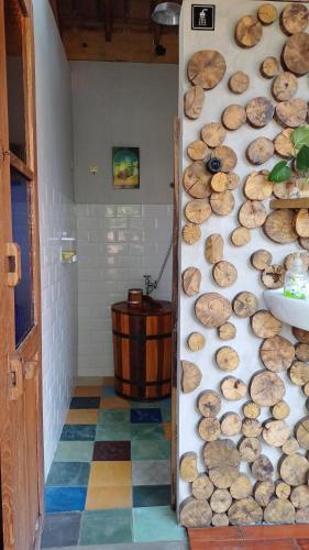 a room with a wall filled with lots of mushrooms at Omah Kepel Yogyakarta in Soprayan