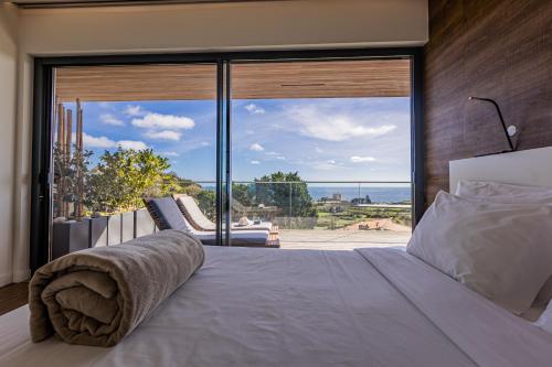 Кровать или кровати в номере Quinta das Camélias - Açores