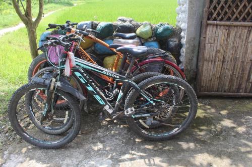 a group of bikes parked next to a building at Shivas Hippies Colony in Sauraha