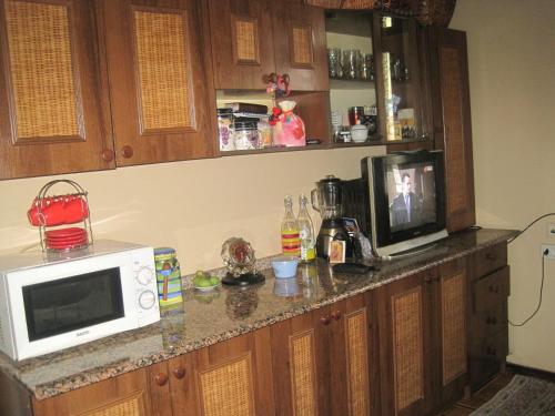 Kuchyň nebo kuchyňský kout v ubytování Metaxa Guesthouse