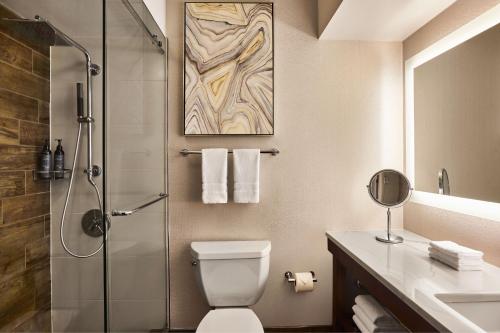 a bathroom with a shower and a toilet and a sink at The Westin San Francisco Airport in Millbrae