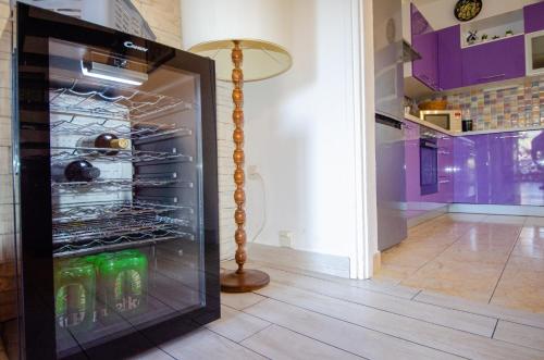 a refrigerator with drinks in it in a kitchen at Villa Danijela with heated pool,jacuzzi and sauna in Seget Vranjica