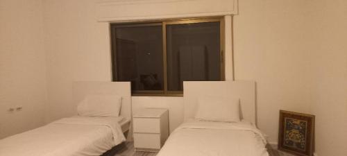 Krevet ili kreveti u jedinici u okviru objekta Khalda Apartments for females
