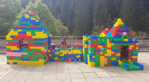 two play structures with colorful legos in a courtyard at Berghotel Almagmach in Immenstadt im Allgäu
